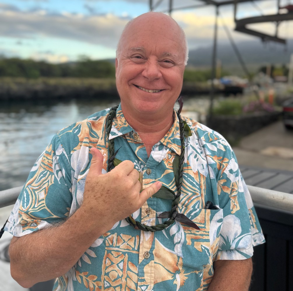 a man holding a glass of water